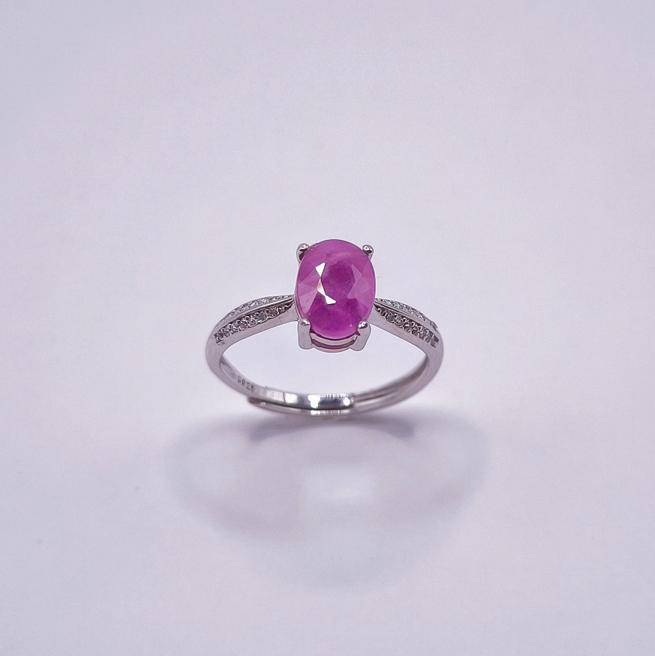 Adjustable ruby ring with oval-cut gemstone in 925 sterling silver