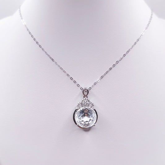 Sterling silver necklace with a polished clear quartz pendant