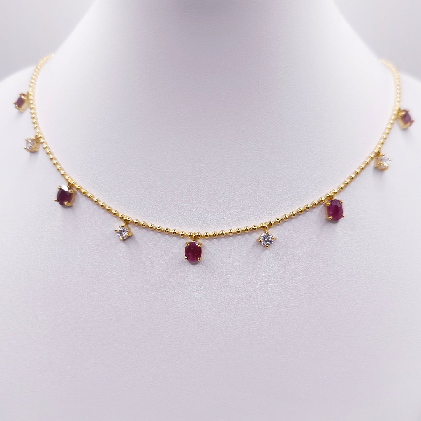 Gold plated sterling silver necklace with oval rubies and moissanite stones